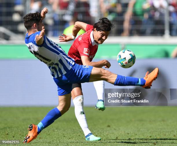 Miiko Albornoz of Hannover is challenged by Mathew Leckie of Berlin during the Bundesliga match between Hannover 96 and Hertha BSC at HDI-Arena on...