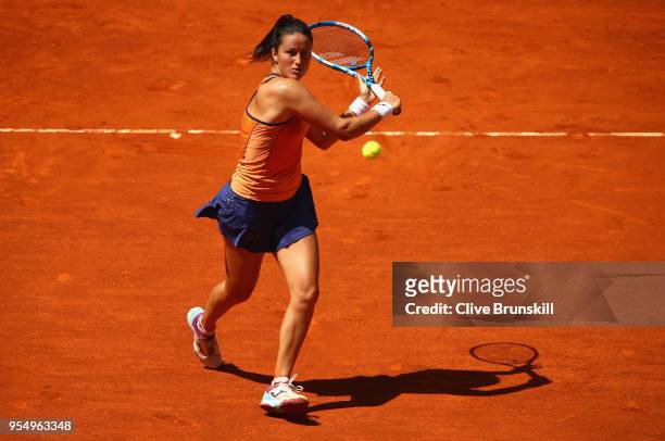 Lara Arruabarrena of Spain runs to play a backhand against Marta Kostyuk of the Ukraine in their first round match during day one of the Mutua Madrid...