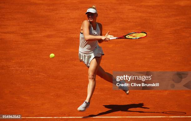 Marta Kostyuk of the Ukraine plays a forehand against Lara Arruabarrena of Spain in their first round match during day one of the Mutua Madrid Open...