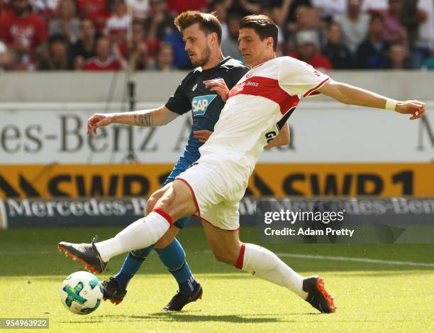 Mario Gomez of VfB Stuttgart is challenged by Havard Nordtveit of 1899 Hoffenheim during the Bundesliga match between VfB Stuttgart and TSG 1899...