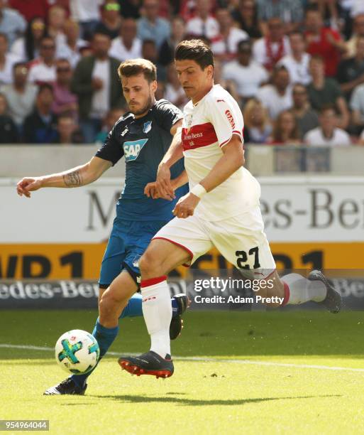 Mario Gomez of VfB Stuttgart is challenged by Havard Nordtveit of 1899 Hoffenheim during the Bundesliga match between VfB Stuttgart and TSG 1899...