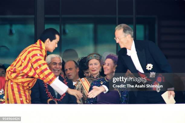 King Jigme Singye Wangchuck of Bhutan and King Baudouin of Belgium shake hands prior to the 'Sokui-no-Rei', Emperor's Enthronement Ceremony at the...