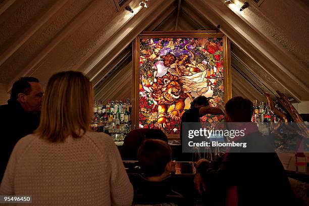 Leaded glass window hangs behind the bar at Tavern On The Green in New York, U.S., on Wednesday, Dec. 30, 2009. The famed New York restaurant in...