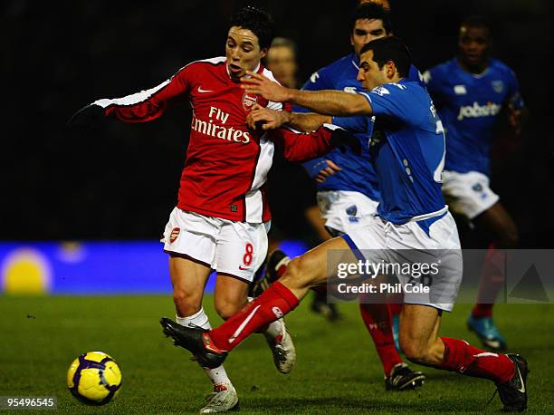 Tal Ben-Haim of Portsmouth challenges Samir Nasri of Arsenal during the Barclays Premier League match between Portsmouth and Arsenal at Fratton Park...