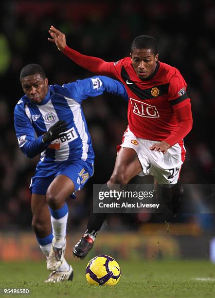 Antonio Valencia of Manchester United surges clear of Charles N'Zogbia of Wigan Athletic during the Barclays Premier League match between Manchester...