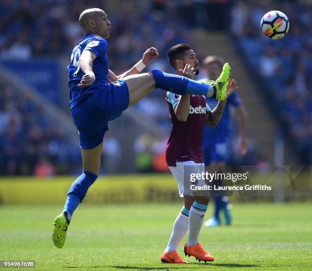 Darnell Johnson of Lleicester City and Winston Reid of West Ham United battle for the ball during the Premier League match between Leicester City and...