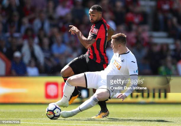 Alfie Mawson of Swansea City and Callum Wilson of AFC Boubrnemouth battle for the ball during the Premier League match between AFC Bournemouth and...