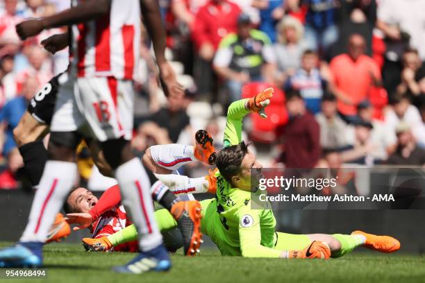 Xherdan Shaqiri of Stoke City loses out to Wayne Hennessey of Crystal Palace during the Premier League match between Stoke City and Crystal Palace at...