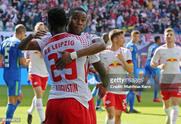 Ademola Lookman of Leipzig jubilates with team mate Jean Kevin Augustin after scoring the first goal during the Bundesliga match between RB Leipzig...