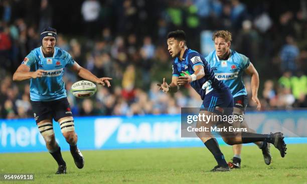 Augustine Pulu of the Blues passes the ballduring the round 12 Super Rugby match between the Waratahs and the Blues at Lottoland on May 5, 2018 in...