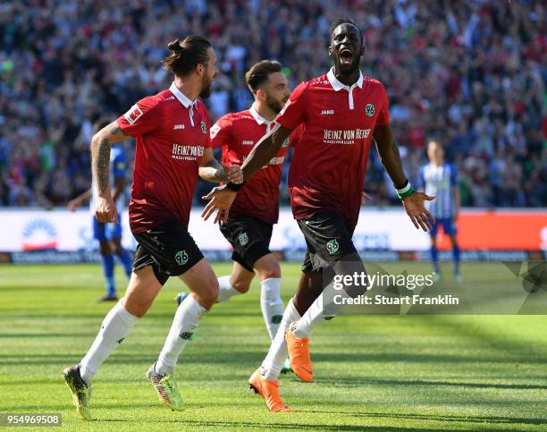 Salif San of Hannover celebrates scoring the second goal during the Bundesliga match between Hannover 96 and Hertha BSC at HDI-Arena on May 5, 2018...