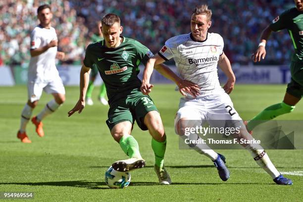 Maximilian Eggestein of Bremen and Dominik Kohr of Leverkusen fight for the ball during the Bundesliga match between SV Werder Bremen and Bayer 04...