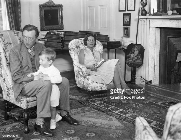 English writer Sacheverell Sitwell at home at Weston Hall, Towcester, UK, with his wife Georgia Doble and their son Reresby, 1929.