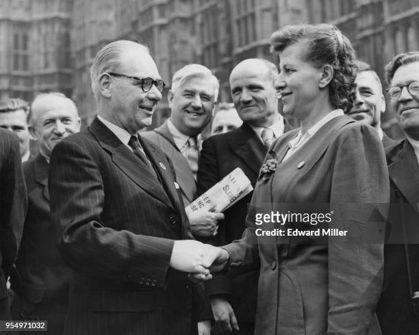 Charles 'Jim' Simmons , the Labour MP for Brierley Hill, welcomes Andreevna Fedina to London outside the Houses of Parliament, 15th May 1956. A...