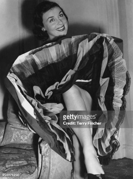 Irish actress Constance Smith wearing a taffeta petticoat at the May Fair Hotel in London, 20th April 1954. She is in the UK to star in the film...