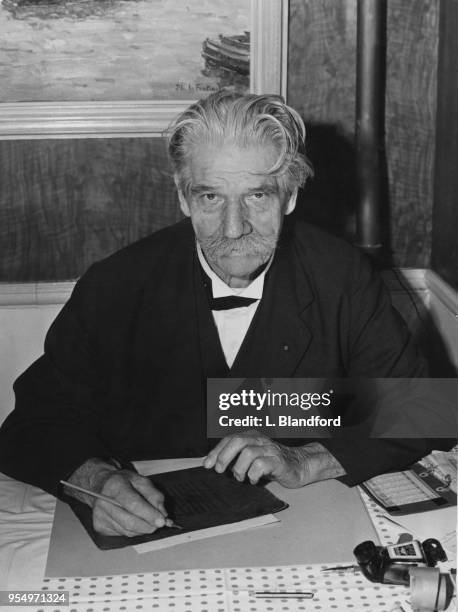 French-German physician and theologian Dr Albert Schweitzer dines out in a restaurant in Westminster, London, 18th October 1955. He is in the capital...