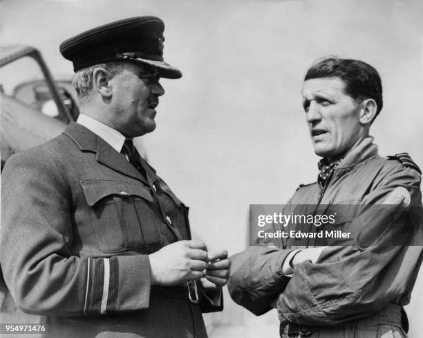 Air Vice Marshal Percy Bernard, the 5th Earl of Bandon chats to Wing Commander Denis Smallwood of the RAF at Biggin Hill, UK, during rehearsals for...