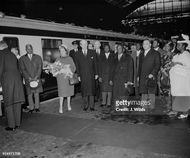 Leopold Sedar Senghor , the President of Senegal, and his wife Colette are met by British Prime Minister Harold Macmillan and Foreign Secretary Alec...