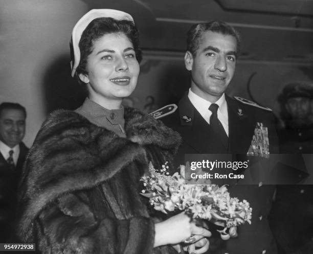 Mohammad Reza Pahlavi, the Shah of Iran with his wife Queen Soraya during a visit to London, 17th February 1955.