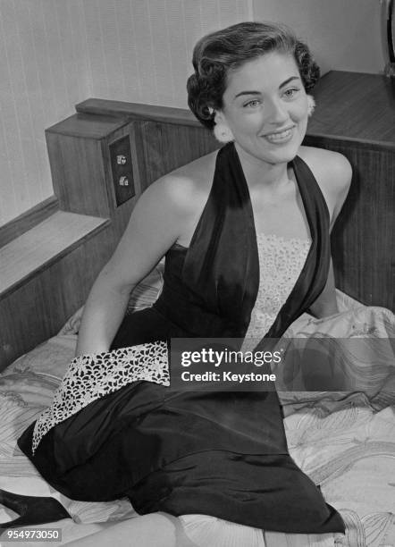 American actress Margaret Sheridan wearing a pair of diamond-studded mink earrings, London, 19th September 1953.