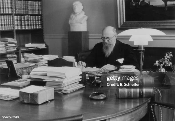 Danish Prime Minister Thorvald Stauning at work in his office, circa 1940.