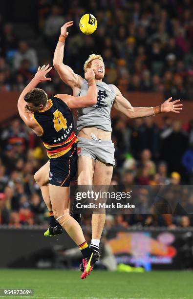 Josh Jenkins of the Adelaide Crows competes for the ball against Andrew Phillips of the Blues during the round seven AFL match between the Adelaide...