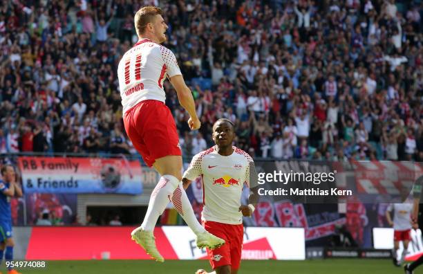Timo Werner of Leipzig jubilates with team mate Ademola Lookman after scoring the second goal during the Bundesliga match between RB Leipzig and VfL...
