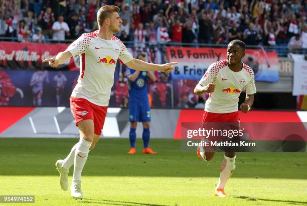 Timo Werner of Leipzig jubilates with team mate Ademola Lookman after scoring the second goal during the Bundesliga match between RB Leipzig and VfL...