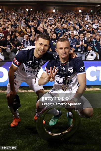 Kosta Barbarouses of the Victory and Besart Berisha of the Victory pose with the trophy after winning the 2018 A-League Grand Final match between the...