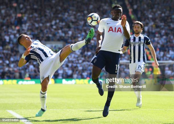 Kieran Gibbs of West Bromwich Albion battles for possession with Victor Wanyama of Tottenham Hotspur during the Premier League match between West...