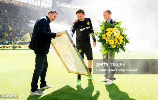 Hans-Joachim Watzke, CEO of Borussia Dortmund, together with Director Of Sport Michael Zorn and goal keeper Roman Weidenfeller for his official...