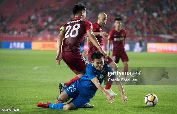 Zhang Chengdong of Hebei China Fortune and Wang Fei of Henan Jiany in action during 2018 Chinese Super League match between Hebei China Fortune adn...