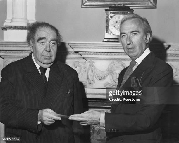 British Conservative politician Norman St John-Stevas , Chancellor of the Duchy of Lancaster and Minister of State for the Arts, presents a cheque...