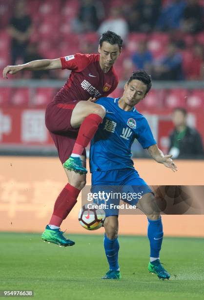 Luo Senwen of Hebei China Fortune and Chen Hao of Henan Jianye in action during 2018 Chinese Super League match between Hebei China Fortune adn Henan...