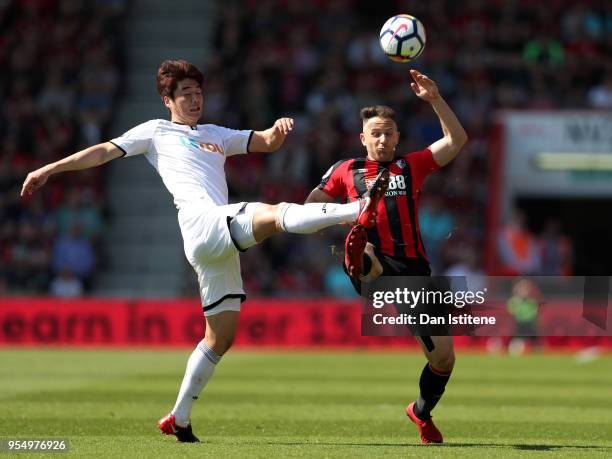 Ki Sung-Yueng of Swansea City and Marc Pugh of AFC Bournemouth battle for the ball during the Premier League match between AFC Bournemouth and...