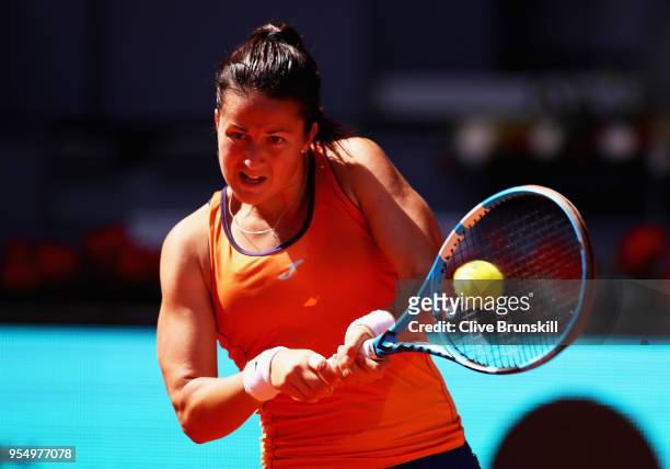 Lara Arruabarrena of Spain plays a backhand against Marta Kostyuk of the Ukraine in their first round match during day one of the Mutua Madrid Open...