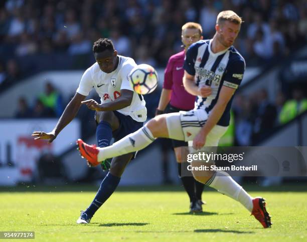 Victor Wanyama of Tottenham Hotspur shoots past Chris Brunt of West Bromwich Albion and misses during the Premier League match between West Bromwich...