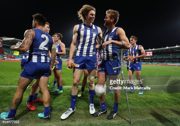 Ben Brown and Ed Vickers-Willis of the Kangaroos celebrate victory after the round seven AFL match between the Sydney Swans and the North Melbourne...