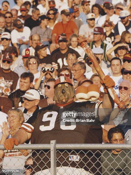 Fan for the Cleveland Browns complete with dog like mask supports his team from the dog pound section of the bleechers during the National Football...
