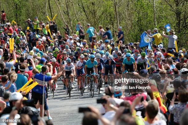 Riders in the peloton climb up the iconic Sutton Bank during the third stage of the Tour de Yorkshire cycling race on May 5, 2018 in Thirsk, United...