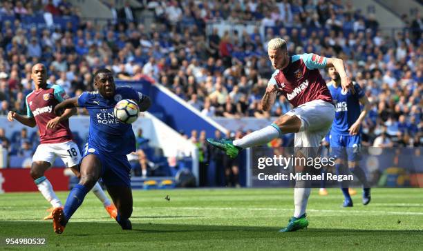 Marko Arnautovic of West Ham United shoots and misses as Wes Morgan of Leicester City looks on during the Premier League match between Leicester City...