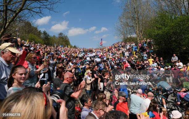 Riders in the peloton climb up the iconic Sutton Bank during the third stage of the Tour de Yorkshire cycling race on May 5, 2018 in Thirsk, United...