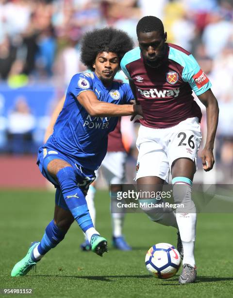 Hamza Choudhury of Leicester City battles for possession with Arthur Masuaku of West Ham United during the Premier League match between Leicester...