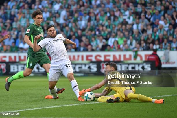 Goalkeeper Jiri Pavlenka of Bremen saves a kick by Kevin Volland of Leverkusen during the Bundesliga match between SV Werder Bremen and Bayer 04...