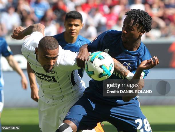 Frankfurt's Ghanaian midfielder Kevin-Prince Boateng and Hamburg's German defender Gideon Jung vie for the ball during the German first division...