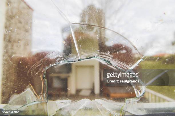 abandoned apartment interior through broken glass - abandoned crack house stock pictures, royalty-free photos & images