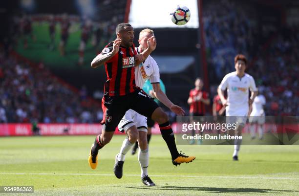 Mike van der Hoorn of Swansea City challenges Callum Wilson of AFC Bournemouth in the box during the Premier League match between AFC Bournemouth and...