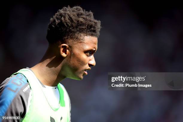 Demarai Gray of Leicester City warms up from the bench during the Premier League match between Leicester City and West Ham United at King Power...