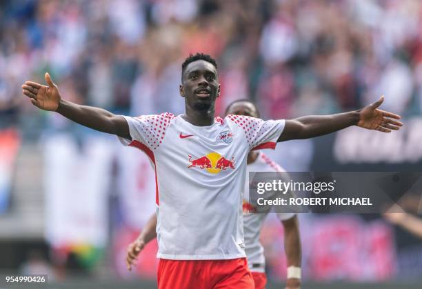 Leipzig's French forward Jean-Kevin Augustin celebrates after scoring the 4-1 during the German first division Bundesliga football match RB Leipzig...