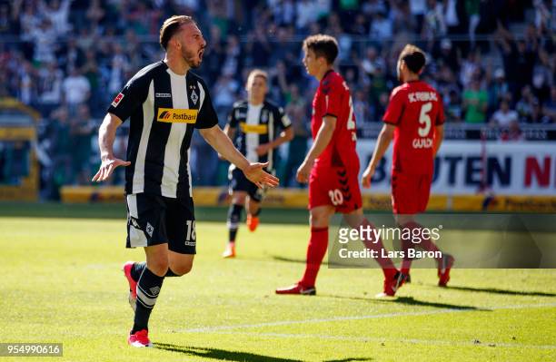 Josip Drmic of Moenchengladbach celebrates after scoring his teams third goal during the Bundesliga match between Borussia Moenchengladbach and...